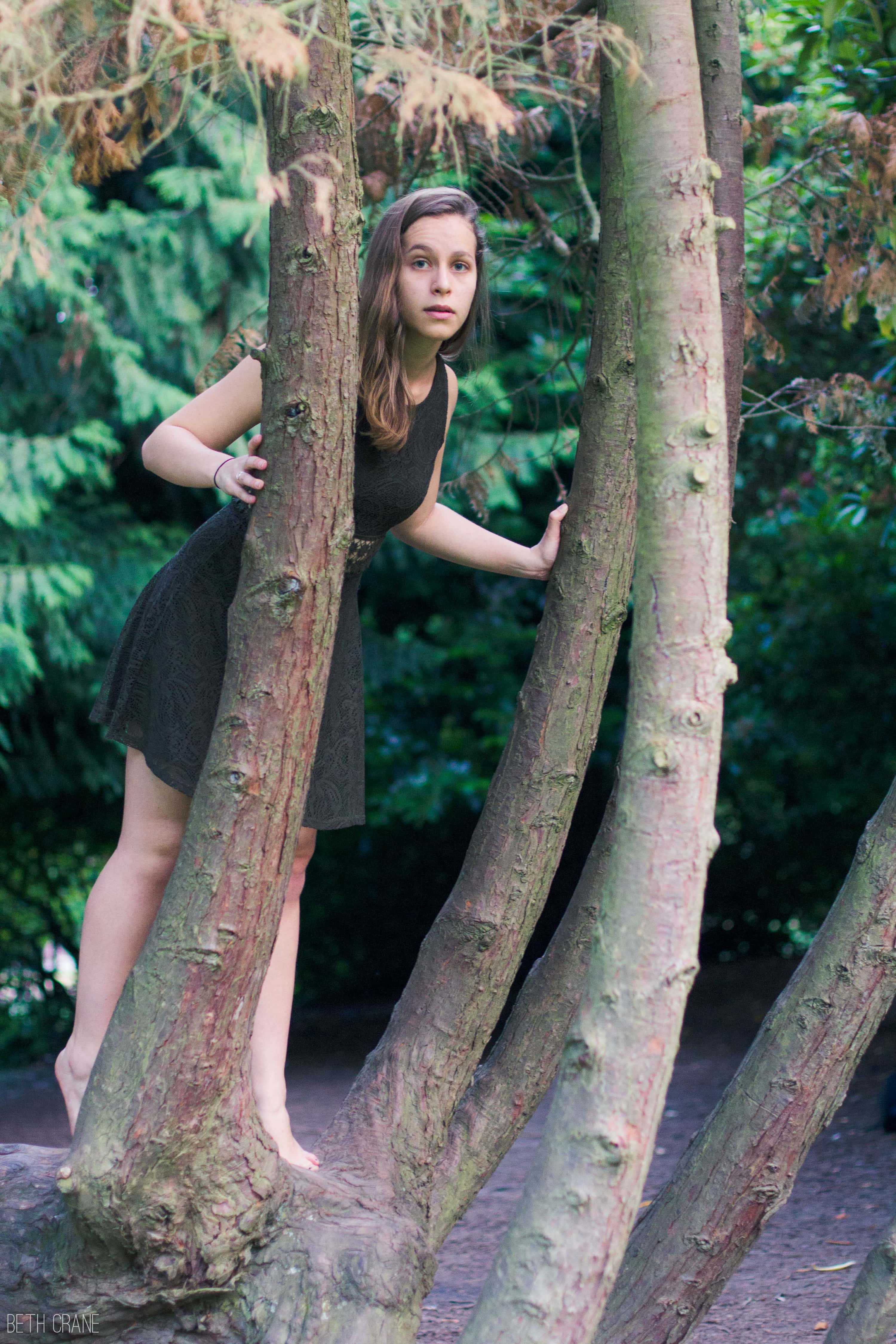 A photo of Hannah in a tree
